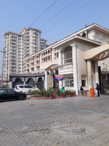 3BHK apartment in SDS NRI Residency, Greater Noida with amenities like swimming pool, gym, tennis courts, and large green areas.