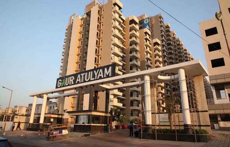 955 sqft 2BHK apartment in GAUR ATULYAM, OMICRON-I, Greater Noida, with gym, swimming pool, and jogging track.