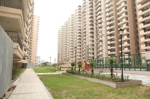 1300 sqft 3BHK apartment in GAUR ATULYAM, OMICRON-I, Greater Noida, with gym, swimming pool, and play area.